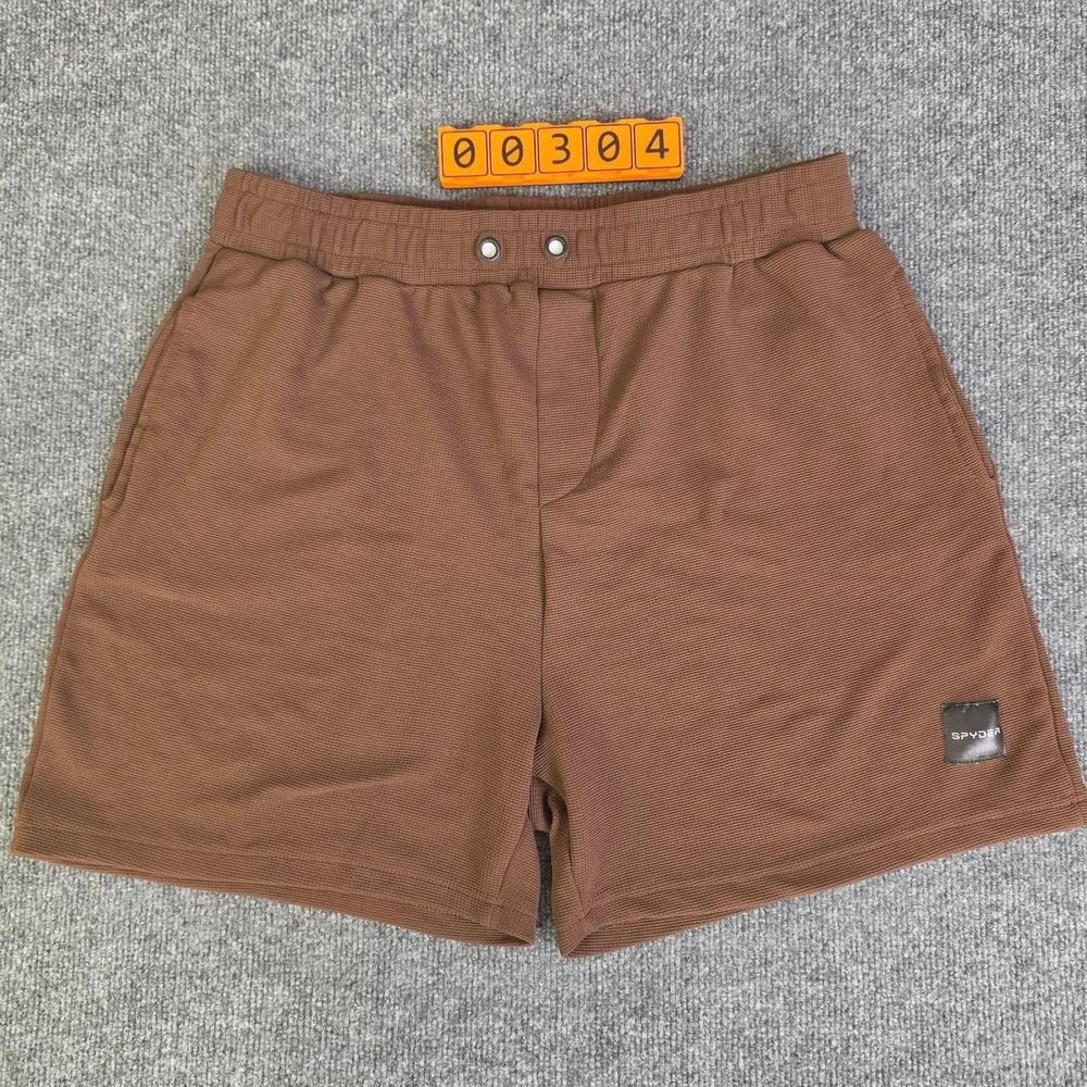 Spyder brown shorts with subtle textured weave Size XL. Missing Drawstring.